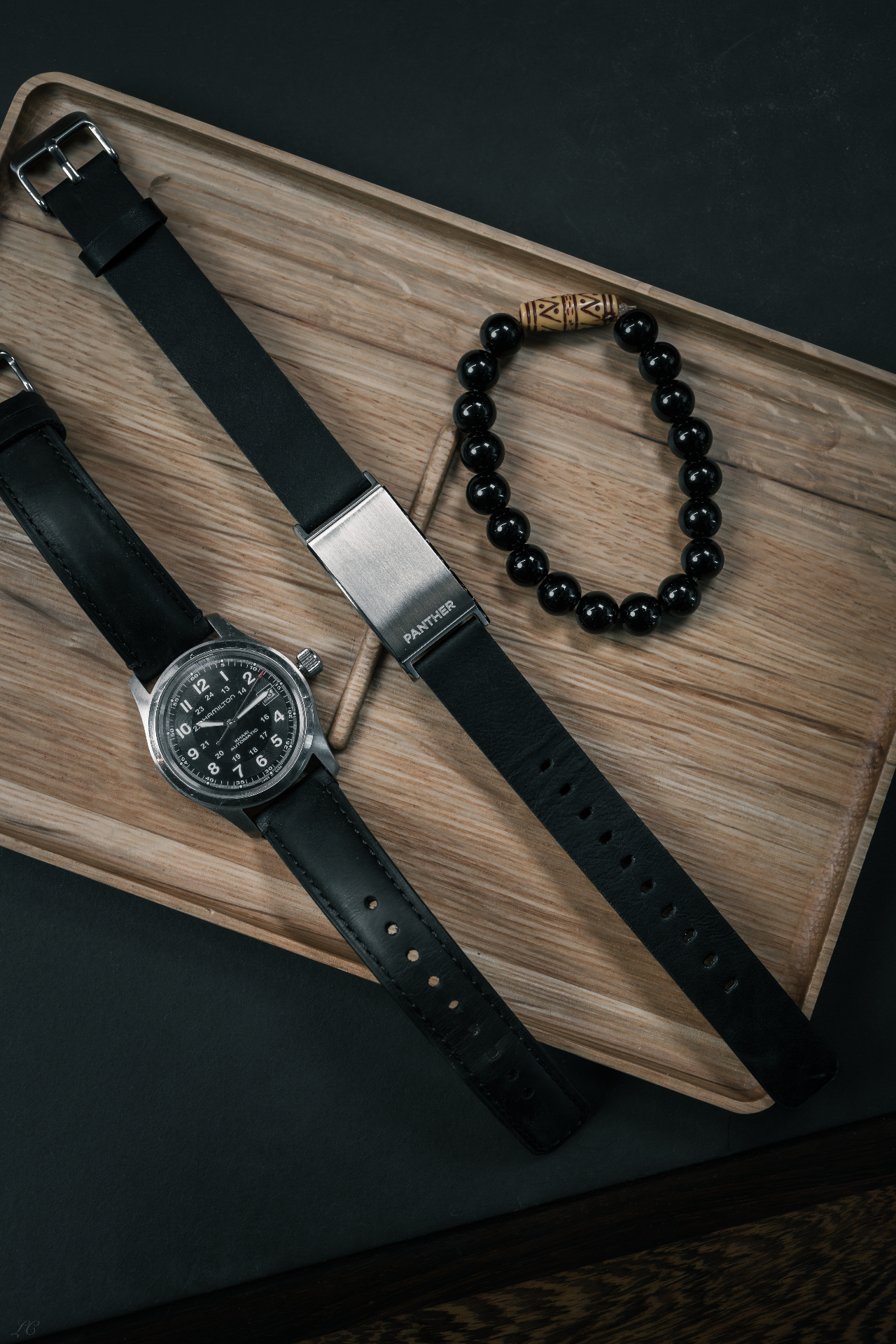 The Panther Eclipse photographed alongside a leather notebook, pen and espresso